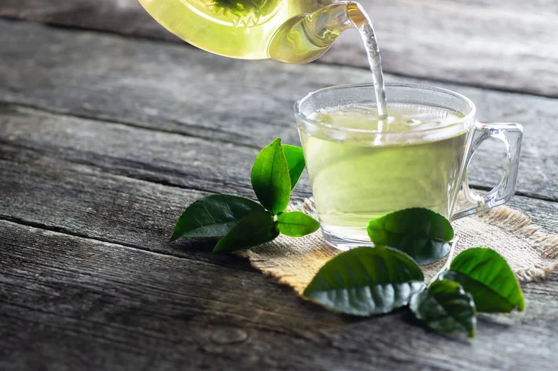 Green tea being poured